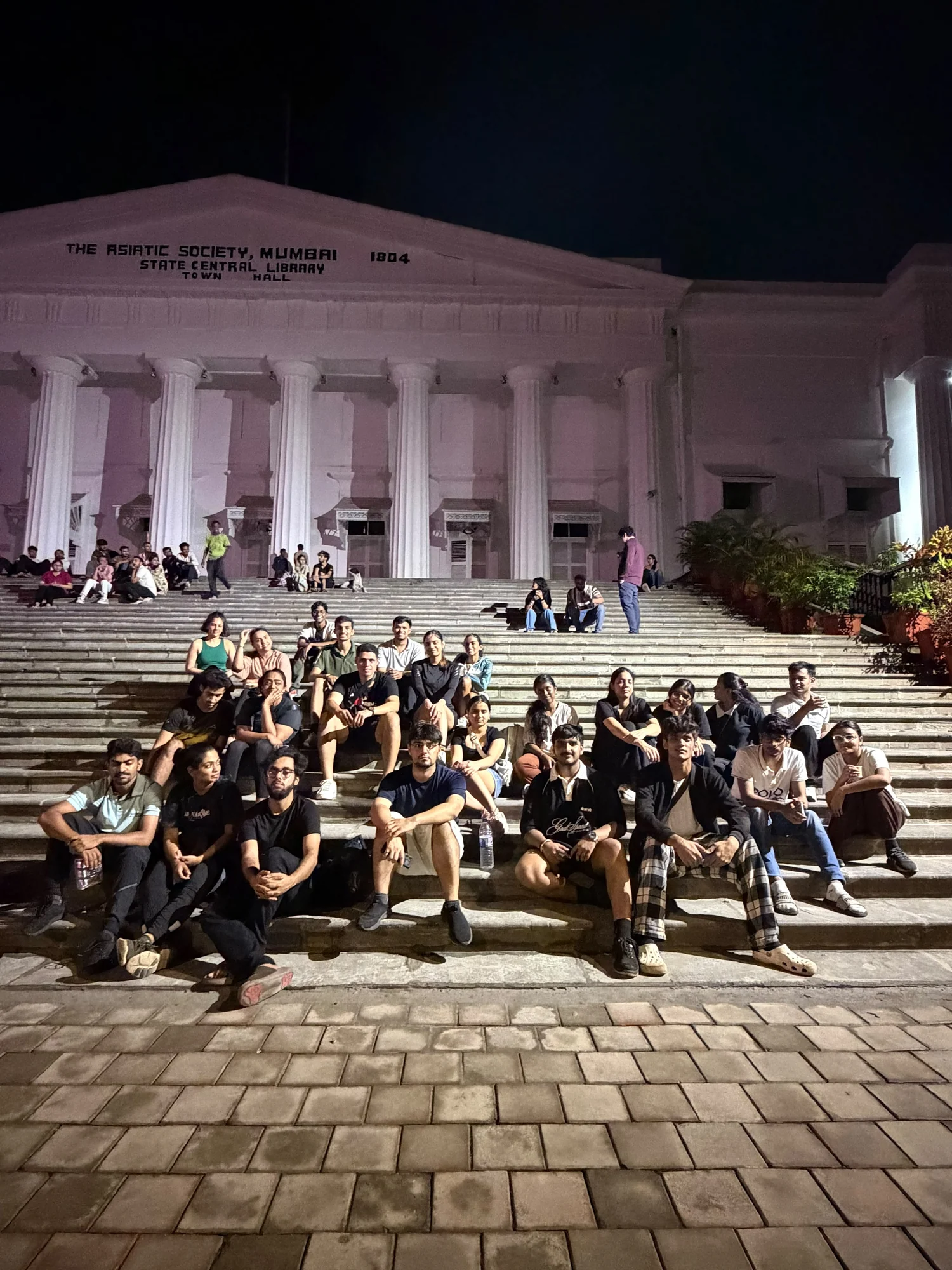 Midnight cyclists at Asiatic Library in Mumbai